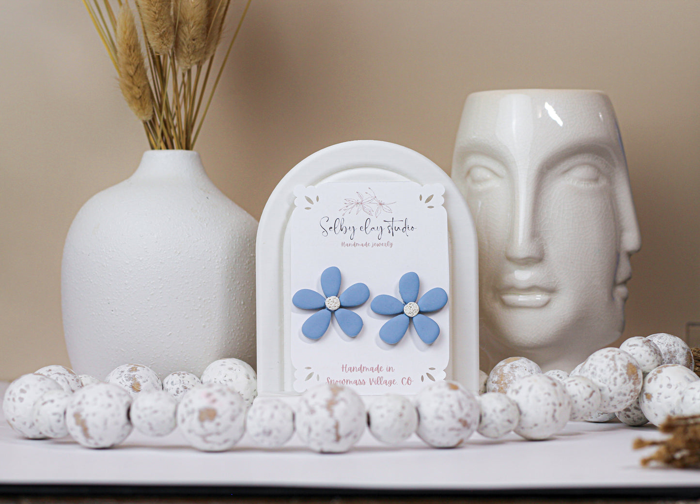 Blue bloom flower stud