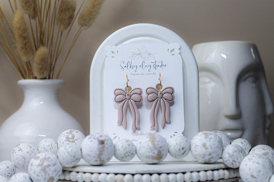 Rose nude dangle bows
