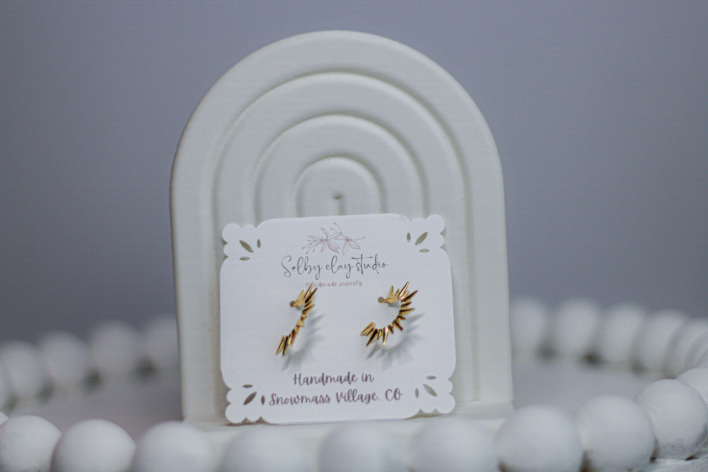 PA spike gold earrings